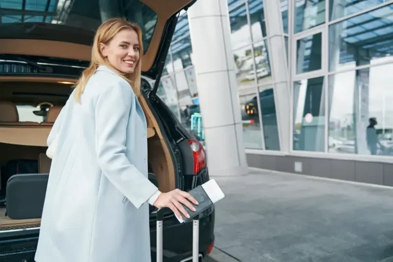 Traveler with luggage at an airport terminal — Chicago airport transfers