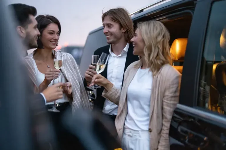 Group toasting champagne beside an SUV at dusk — Chicago celebrations