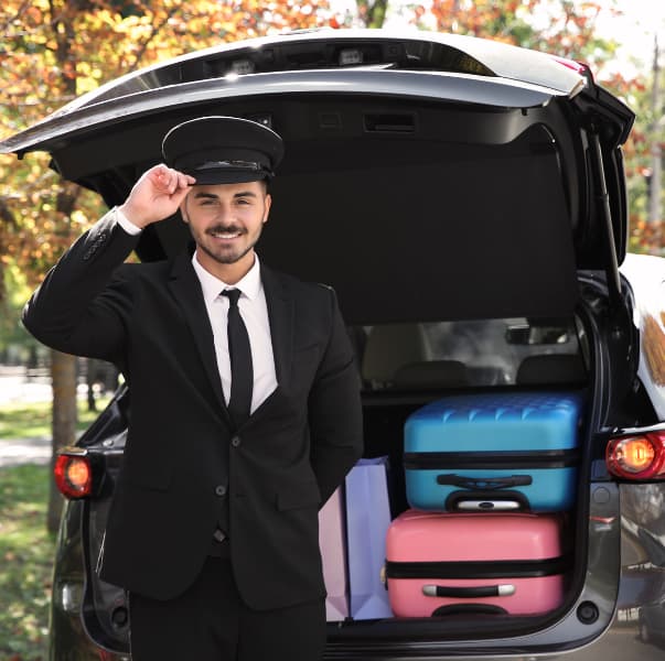 Chauffeur loading luggage at the trunk — Chicago airport transfers