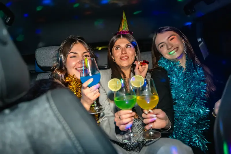 Guests toasting inside a limousine — Chicago party transportation